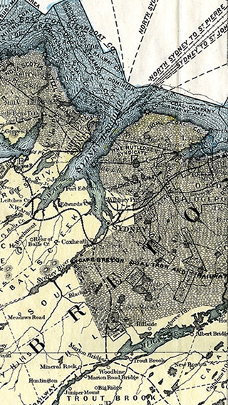 Carte géographique de l’île du Cap-Breton en couleurs qui indique les limites des circonscriptions électorales, les voies ferrées et les zones charbonneuses.